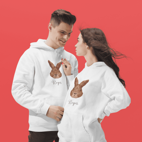 mockup of a cool young couple wearing pullover hoodies at a studio cropped