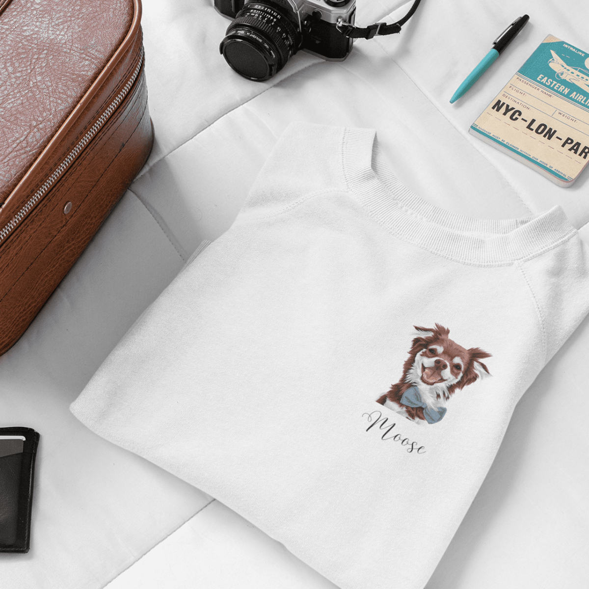 mockup of a sweatshirt on a bed next to a suitcase 33728 1 1